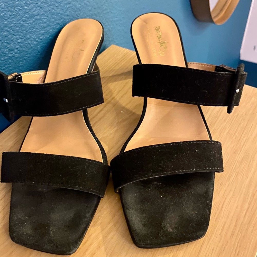 Black suede coach kitten heels.